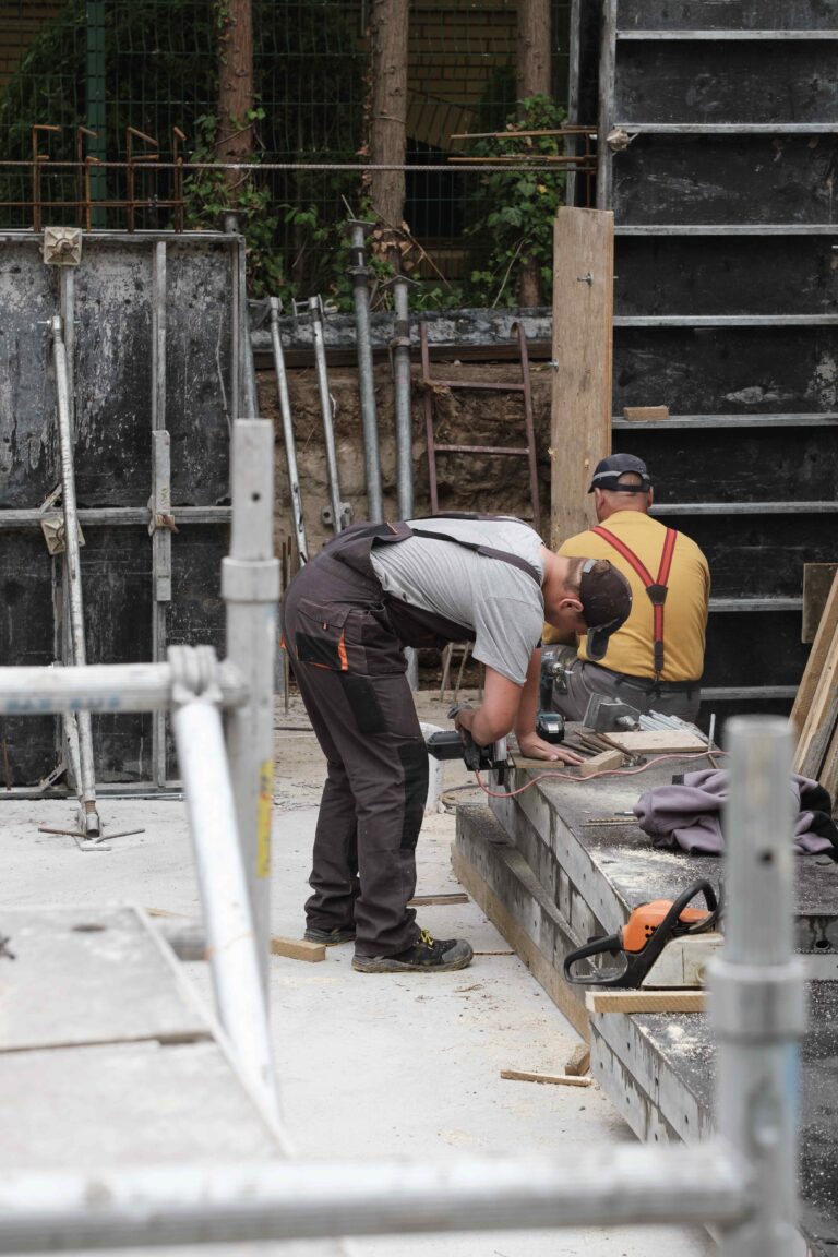man-working-at-construction-site-building-house