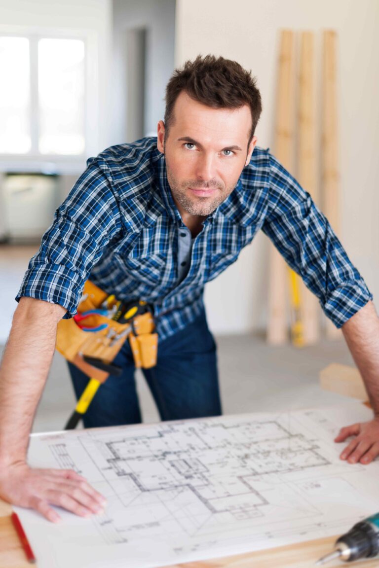 portrait-of-handsome-construction-worker-with-home