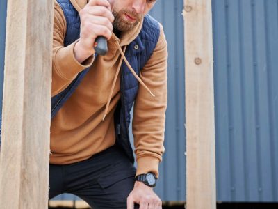 man-worker-hammering-while-building-wooden-frame